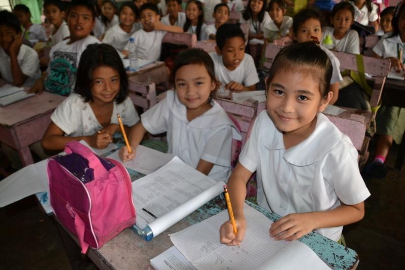 Children at their desks during a lesson